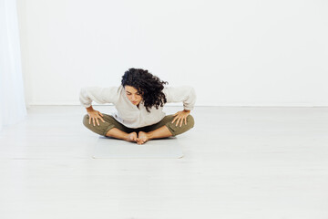 a woman brunete doing yoga relaxation exercises