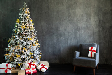 Christmas tree with gifts in a dark room new year christmas chair interior