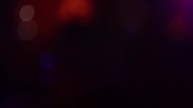 Strobe lights on the party, blurred laser light in a night club. Light background.