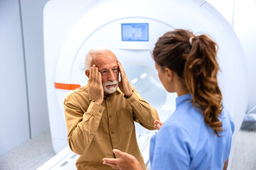 Patient complaining about extremely painful headaches before MRI procedure.