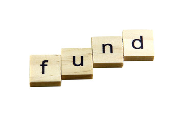 Short word english letter with text "fund" on a small wooden cubes block with white background.