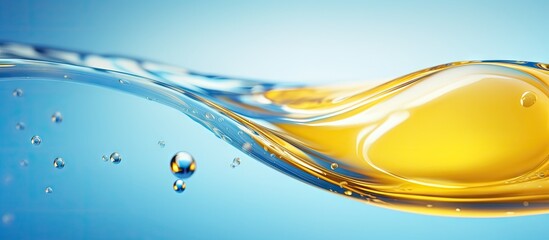 Macro creative image showcasing the beauty of the transparent water drop on a smooth surface with blue and yellow hues emphasizing the environment and nature Copy space image Place for adding t