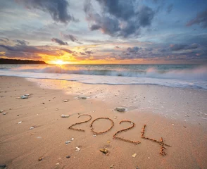 Foto auf Acrylglas 2024 year on the sea shore during sunset © GIS