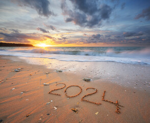 2024 year on the sea shore during sunset