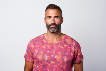 Portrait of a content man in his 40s donning a trendy cropped top against a white background. AI Generation