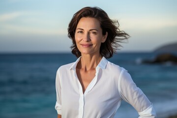 Portrait of a glad woman in her 40s donning a classy polo shirt against a tranquil ocean backdrop. AI Generation