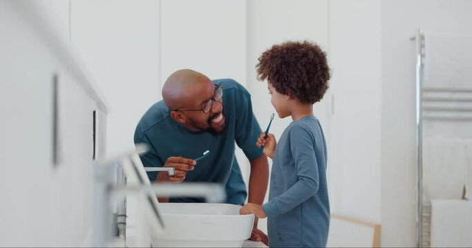 Child, learning and brushing teeth with dad in bathroom, morning and self care in family home. Teaching, grooming and father with kid in dental routine with toothpaste and toothbrush for oral health