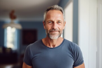 Portrait of a tender man in his 50s sporting a vintage band t-shirt against a modern minimalist interior. AI Generation