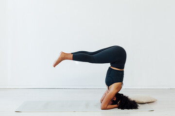 woman doing exercises yoga asana lotus pose workout - obrazy, fototapety, plakaty
