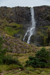 Fototapeta na wymiar Scenic view of Bjarnarfoss waterfall (height 80 metres) located on the south of Snæfellsnes peninsula, Iceland