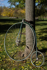Fototapeta premium Penny farthing bicycle. High wheeler bicycle in park