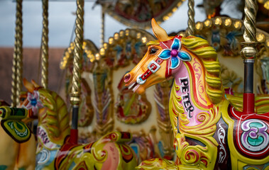 Fototapeta na wymiar Colorful horse on a Merry go round at a fair
