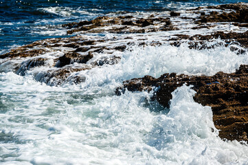 waves crashing on rocks