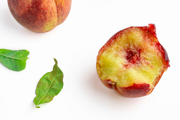 Bitten ripe juicy peach on a white background. Ripe peach