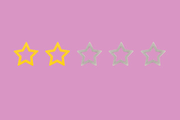 Gold, gray, silver five star shape on a pink background. Increase rating or ranking, evaluation and...