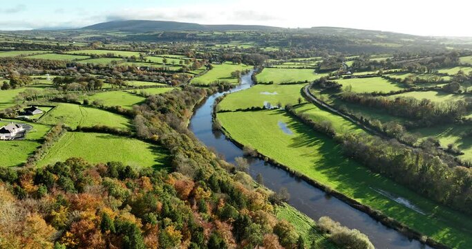 Golden autumn. Autumn landscape with a river and colourful autumn forest 4k