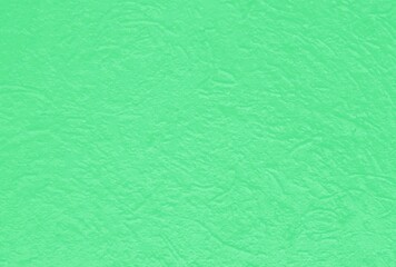 Beautiful green paper with a three-dimensional structure of crumpled paper
