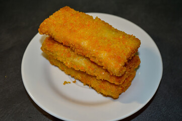 Risoles Mayonnaise or Risol Mayo, Indonesian street food made from flour shell filled with mayonnaise and sausage. selective focus.