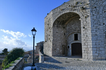 Fototapeta na wymiar A narrow street between the old houses of Gesualdo, a medieval village in Campania, Italy.