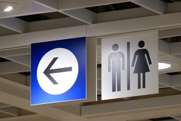 Close up man and woman washroom logo inside Ikea store
