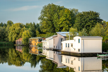 Scenery with floating houses in dutch village of Halfweg, municipality of Haarlemmermeer - obrazy, fototapety, plakaty