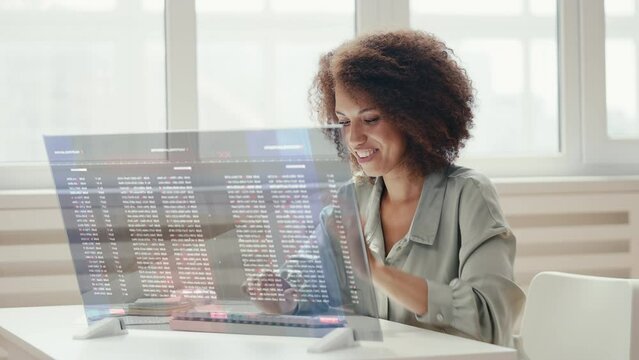 Woman IT expert satisfied with newly created computer program, making tests
