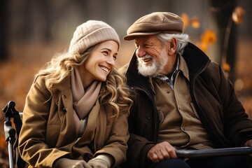 a couple of disabled people in an autumn park on a wheelchair
