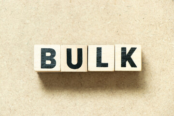 Alphabet letter block in word bulk on wood background