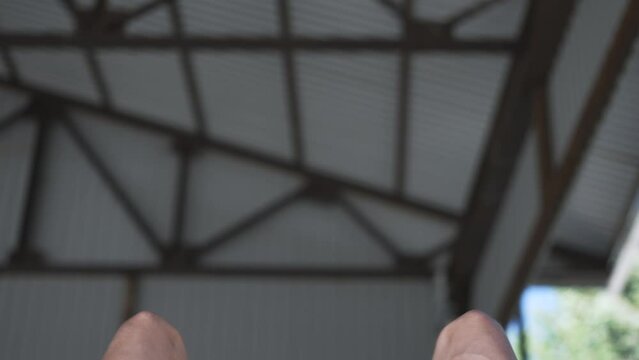 Back of a man on parallel bars