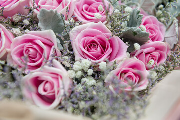 Closeup of pink roses bouquet with white and purple grass - obrazy, fototapety, plakaty