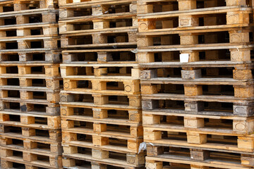used wooden pallets stacks, full-frame background