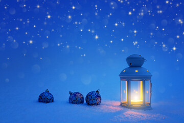 Christmas card with a lantern and three balloons in the snow. Christmas background with a lantern and Christmas balls