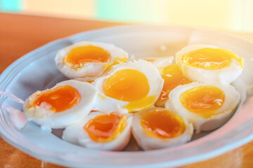Sliced soft boiled eggs on dish