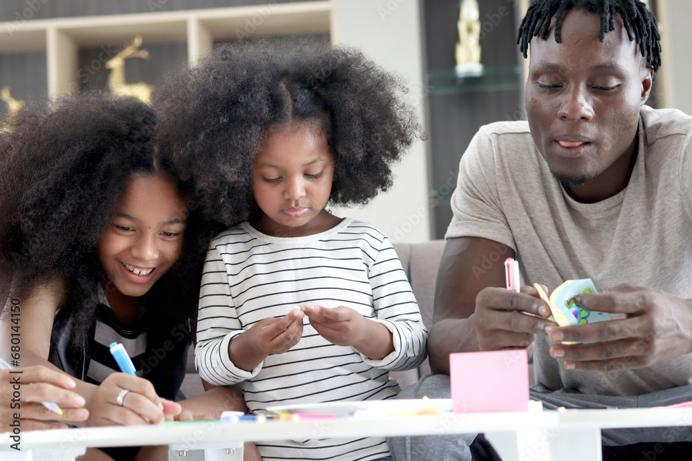 Wall mural happy family love bonding, african father and two daughter girls with curly hair enjoy spending time