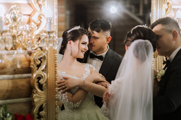 portrait of a happy bride and groom in the hall of a modern hotel near a mirror. Winter wedding.