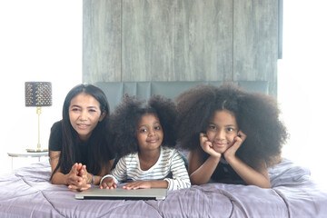 Happy family love bonding, enjoy spending time together at home, Portrait of African Asin mixed...
