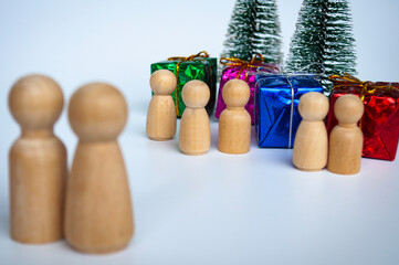 Father and mother giving out presents to their children during Christmas day