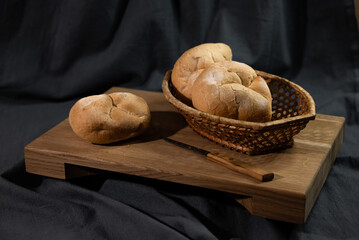 Three buns on a cutting board