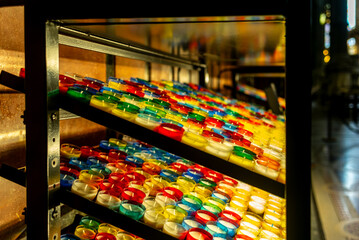 Many colorful candles in a church in France