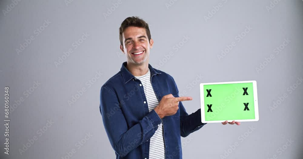 Poster happy man pointing at tablet, green screen and mockup space, advertising and marketing. portrait, te