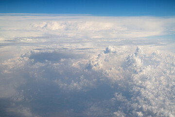 above the clouds, view above clouds from airplane window, flight, by airplane