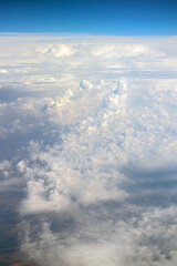 above the clouds, view above clouds from airplane window, flight, by airplane