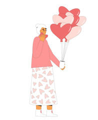 Senior woman holding balloons in heart shape. Valentine's Day.