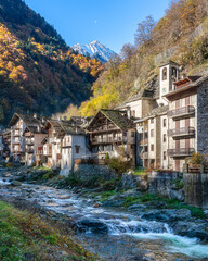 Fototapeta na wymiar The beautiful village of Rassa, during fall season, in Valsesia (Sesia Valley). Province of Vercelli, Piedmont, Italy.