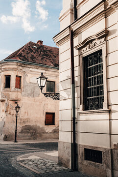 Vertical photo of historic city center in Trnava city - Slovakia. Wide angle shot of old town street in Trnava Urban and street concept.