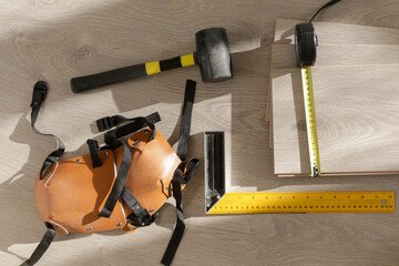 Rubber hammer, ruler with angle bar, tape meter, jig saw and other tools for installation of...