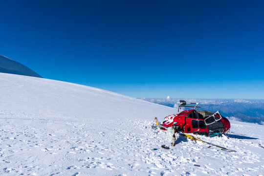 broken helicopter in the mountains on the snow in the Swiss Alps, Monte Rosa or Dufourspitze the highest mountain in Switzerland.
