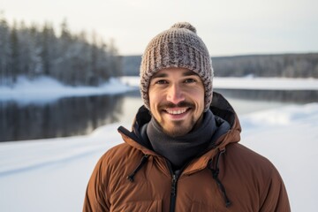 Portrait of a happy man in his 30s dressed in a warm ski hat against a backdrop of a frozen winter lake. AI Generation