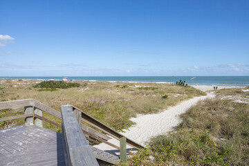 Fototapeta premium A pathway leads towards the Atlantic Ocean at Lori Wilson Park (Cocoa Beach), Florida.