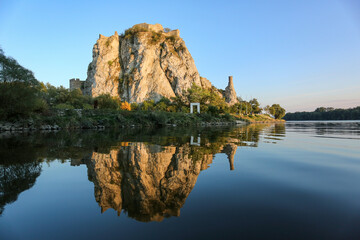 Devin castle ruin in Bratislava reflecting in river March at Danube confluence - obrazy, fototapety, plakaty